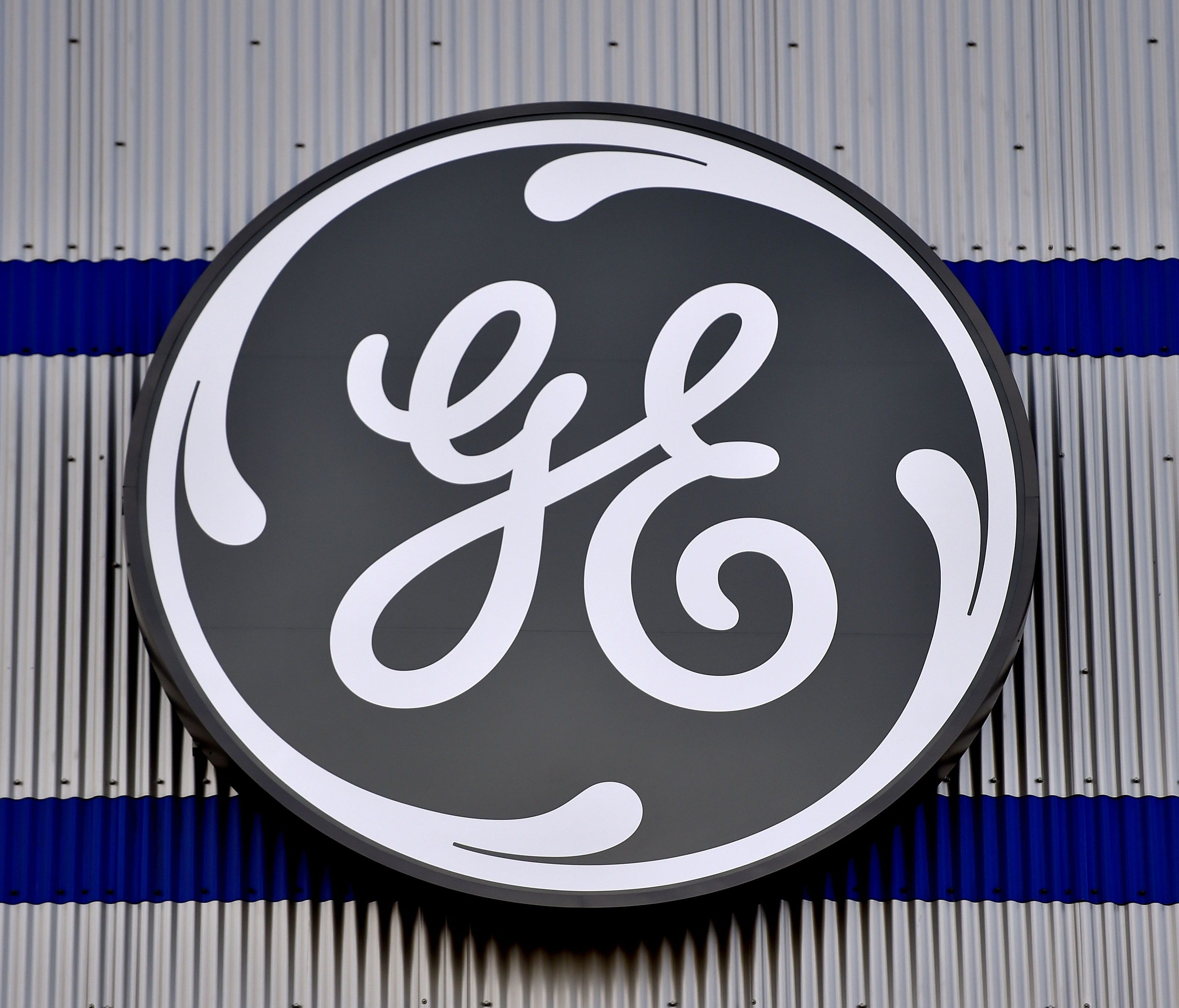 (FILES) In this file photo taken on November 21, 2016 the logo of US company General Electric is seen at a factory of the group,  in Montoir-de-Bretagne, western France.    French Labour Minister Muriel Penicaud said on June 17, 2018 that General Elec