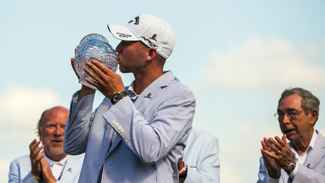 June 11, 2017 - Golfer Daniel Berger kisses his trophy after winning the 2017 FedEx St. Jude Classic at TPC Southwind on Sunday afternoon. Berger also won the tournament last year.
