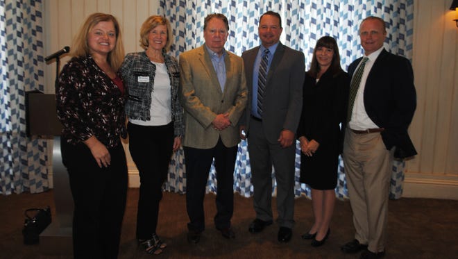 CenterState Bank executives (from left) Tammy Roncaglione, St. Lucie County area executive, Diana Walker, vice  president/Vero Beach branch manager; Joe Keating; John Woods, vice president/financial adviser; Ginger Geiger, NBC Securities; and Chris Bieber,  Indian River County area executive