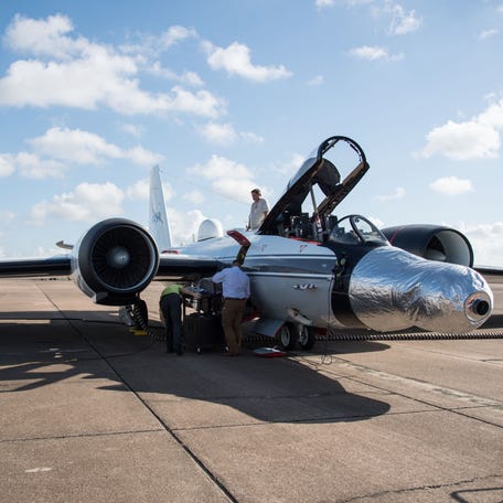One of the WB-57F jets is readied for a test run at NASA's Johnson Space Center in Houston. The eclipse-viewing instruments are mounted under the silver casing on the nose of the plane.
