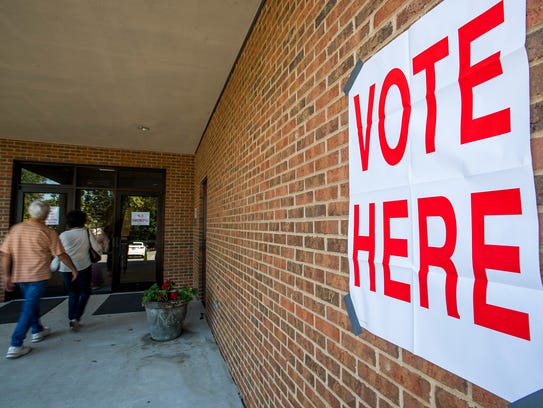 Voters arrive to vote at the polls located at Dalraida