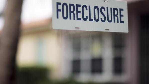 
A foreclosure sign hangs in front of a home.
