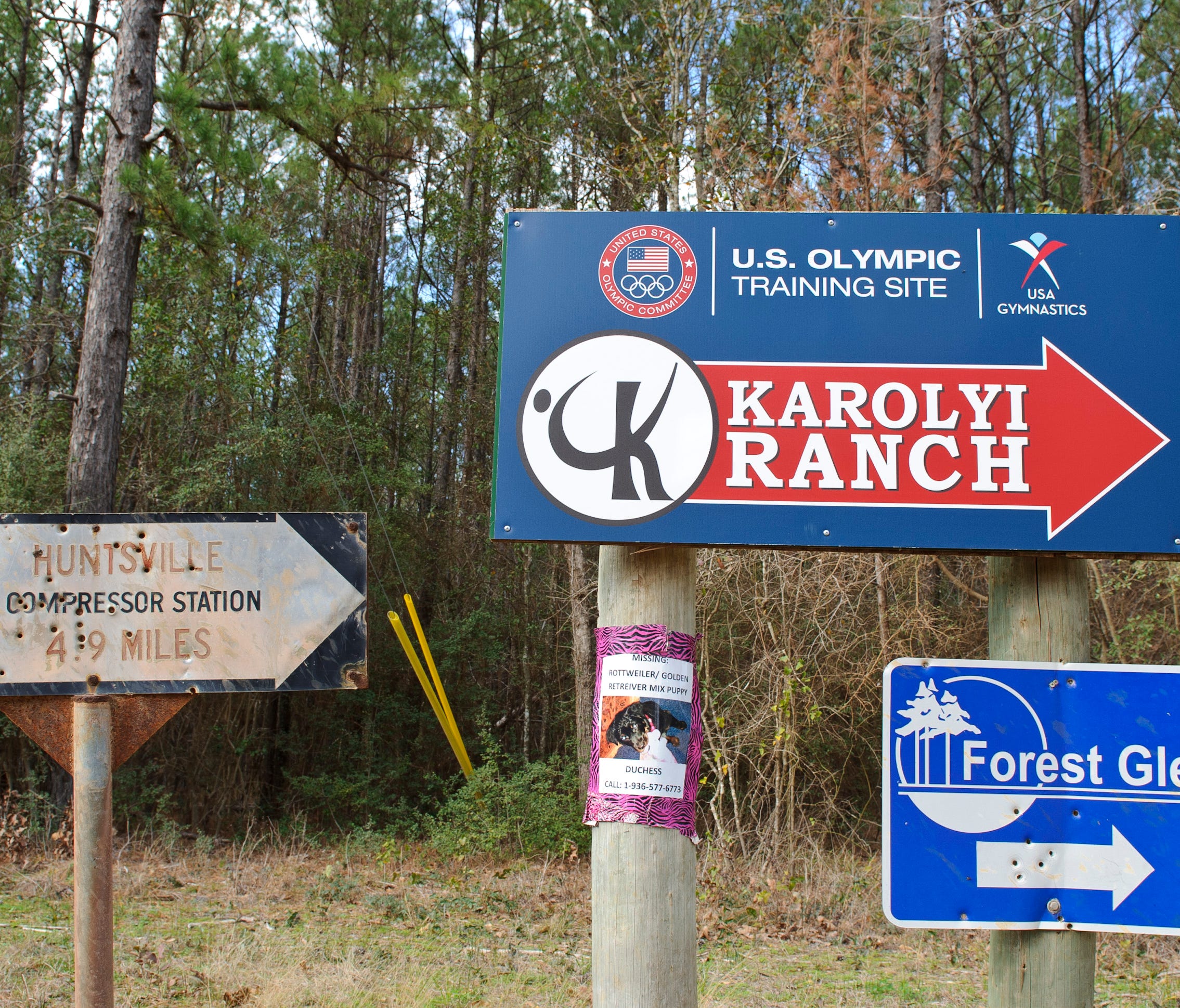 Signs point the way to the Karolyi Ranch in New Waverly, Texas, in a file photo from 2012.