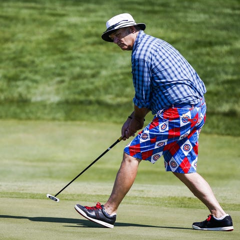 Actor and comedian Bill Murray reacts to his putt 