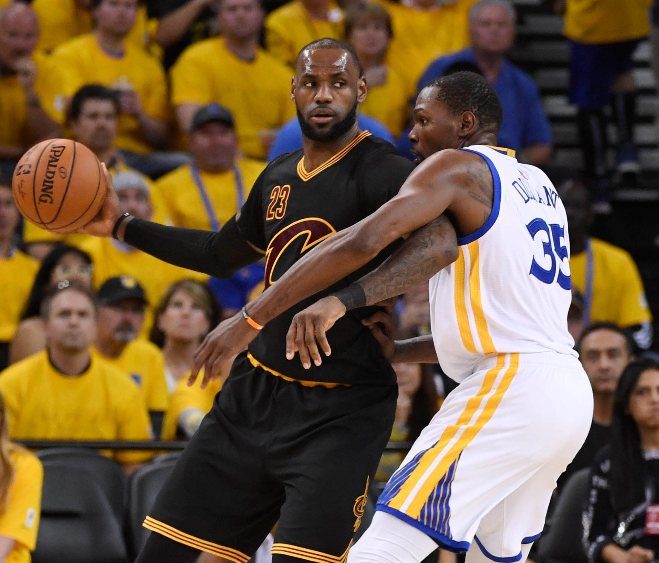 Cleveland Cavaliers forward LeBron James (23) is defended by Golden State Warriors forward Kevin Durant (35) during the third quarter in game five of the 2017 NBA Finals at Oracle Arena.