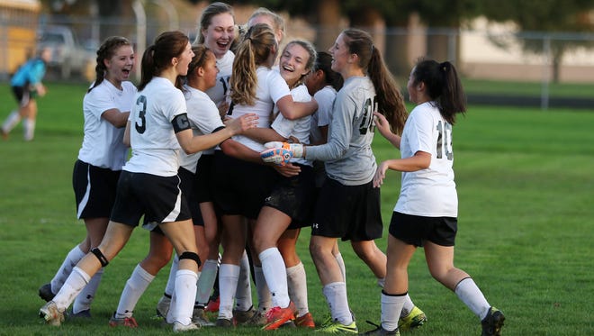  Cascade celebrates a 2-0 win over McLoughlin in the first round of the OSAA Class 4A state playoffs on Tuesday, Nov. 1, 2016, at Cascade High School in Turner.  