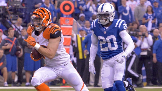 Bengals running back Rex Burkhead runs for a first down in the first half  at Lucas Oil Stadium in Indianapolis during Sunday's AFC Division Playoff between the Cincinnati Bengals and Indianapolis Colts.