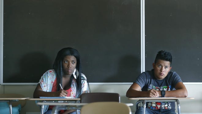 Labria Buie and Giezi Gonzalez attend a global science class during the Rochester City School District summer school program at Edison Technology Campus on July 23, 2015.