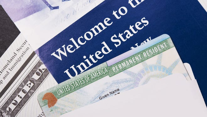 Immigration welcome letter and green card