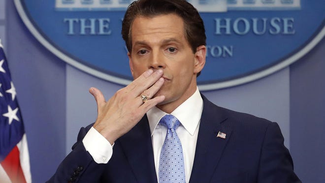 In this July 21, 2017 photo, incoming White House communications director Anthony Scaramucci, right, blowing a kiss after answering questions during the press briefing in the Brady Press Briefing room of the White House in Washington. Scaramucci is out as White House communications director after just 11 days on the job. A person close to Scaramucci confirmed the staffing change just hours after President Donald Trumpâs new chief of staff, John Kelly, was sworn into office. (AP Photo/Pablo Martinez Monsivais)
