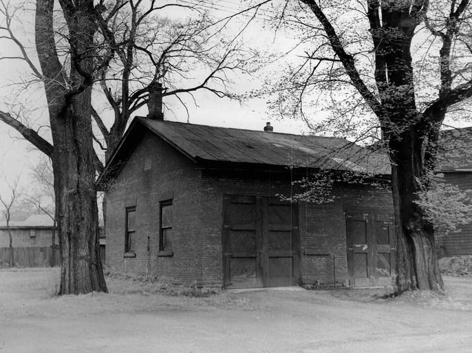 One-Room School Now a Warehouse - Built in the mid 1800's for 13 children of neighboring farmers, this one-room red brick structure was called Penfield Station School. The name was changed to Despatch District 9 School when the Village of Despatch was founded in 1897, and abandoned in 1898 when a roster of 60 pupils necessitated building of Union Free School. Located on Washington Street, it is used by the A. H. Bown estate for storage. (Staff photo) TU 5/26/1947