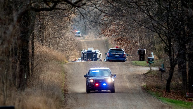 Michigan State Police investigate the scene on Wilcox Road where a suspect was shot and killed by an Eaton County deputy after a chase on Tuesday, Nov. 28, 2017, in Brookfield Township west of Eaton Rapids.