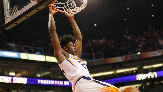 Phoenix Suns forward Josh Jackson (20) dunks against the Oklahoma City Thunder during the first quarter at Talking Stick Resort Arena in Phoenix January 7, 2018.