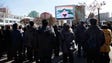 People watch the news broadcast announcing North Korean