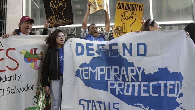Supporters of Temporary Protected Status immigrants chant at a rally in San Francisco on March 12, 2018, before a news conference announcing a lawsuit against the Trump administration over its decision to end the program that lets immigrants live and work legally in the United States.