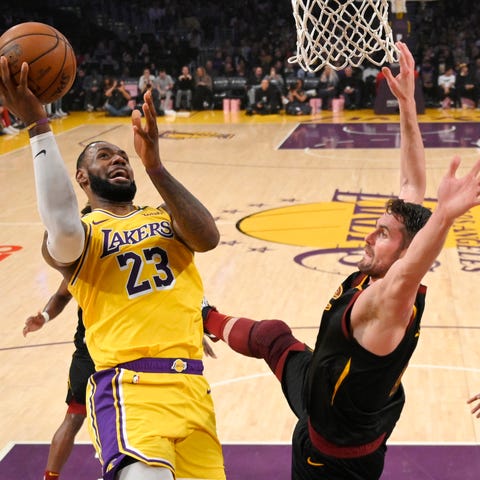 Los Angeles Lakers forward LeBron James, left, sho