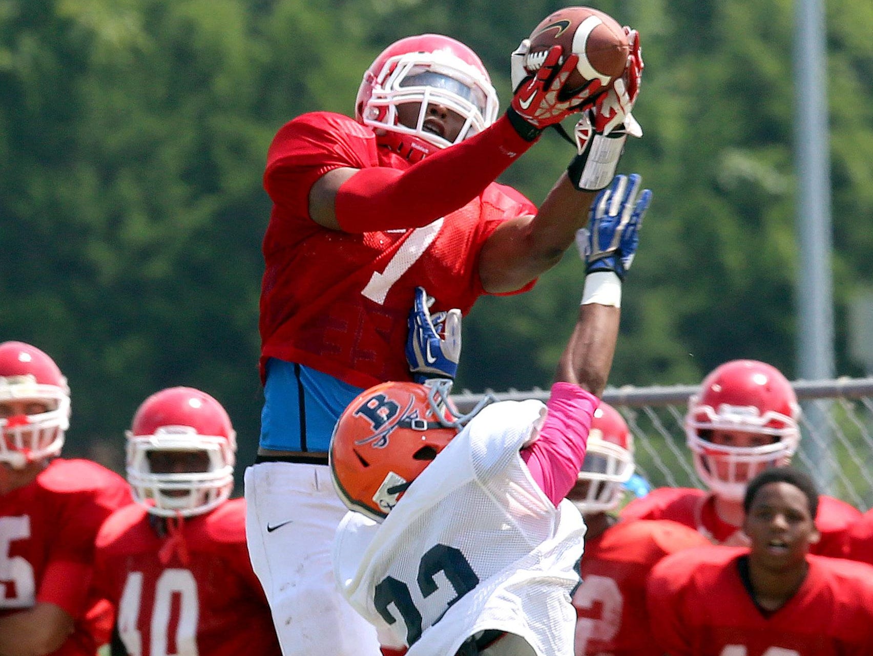 Oakland sophomore Jacoby Stevens goes up for a catch over a Beech defender a scrimmage.