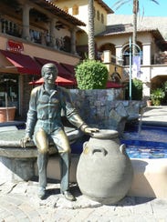 A bronze statue of Sonny Bono sits on Mercado Plaza