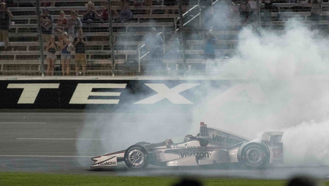 IndyCar Series driver Will Power (12) celebrates winning the Rainguard Water Sealers 600 at Texas Motor Speedway.