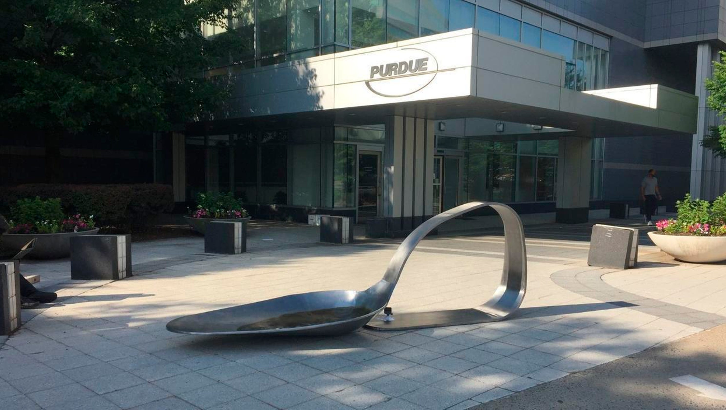 Drug spoon sculpture placed outside Purdue Pharma headquarters