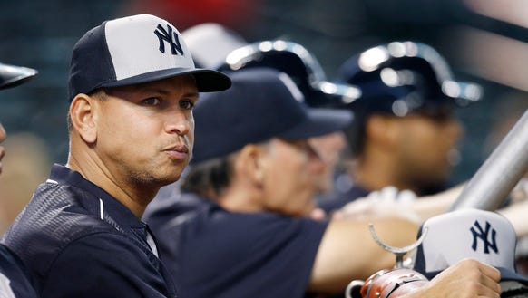 An injured New York Yankees' Alex Rodriguez watches