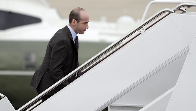 FILE - In this Nov. 2, 2018, file photo, President Donald Trump's White House Senior Adviser Stephen Miller boards Air Force One for campaign rallies in West Virginia and Indiana, in Andrews Air Force Base, Md. The White House is digging in on its demand for $5 billion to build a border wall as congressional Democrats stand firm against it, pushing the federal government closer to the brink of a partial shutdown. Miller says Trump is prepared to do âwhatever is necessaryâ to build a wall along the U.S.-Mexico border. (AP Photo/Evan Vucci, File)