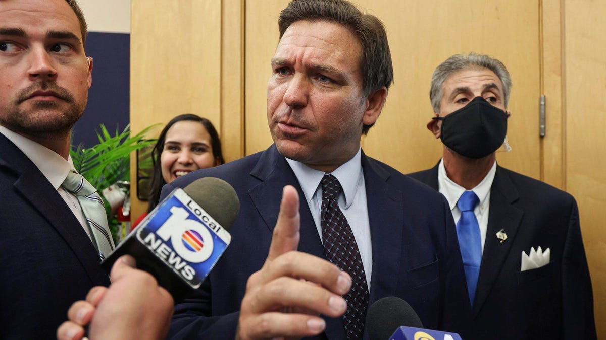 Florida Gov. Ron DeSantis responds to reporters' questions Monday in Miami.