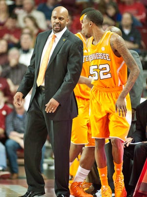 Tennessee coach Cuonzo Martin talks with guard Jordan McRae during a game last season.