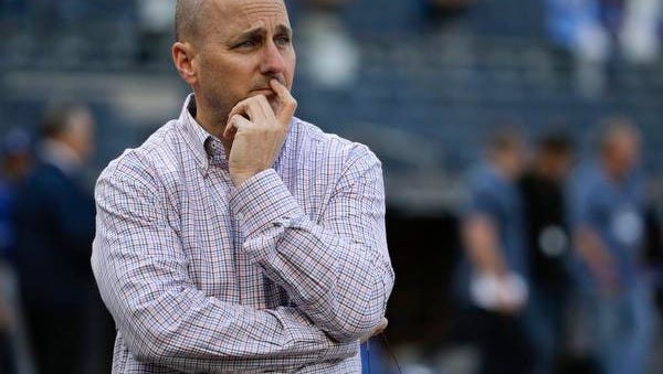 New York Yankees general manager Brian Cashman watches batting practice before the team's baseball game against the Kansas City Royals in New York. With his team around the .500 mark since late May, Cashman said Tuesday, internal discussions among management have intensified and he will pass along any trade offers to ownership.