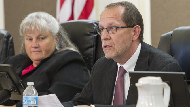 Battle Creek Mayor Dave Walters, right, speaks during a 2014 City Commission meeting.