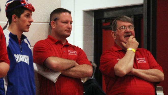 Tristin Badida of Conner, left, assistant coach Clint Bell, middle, and Conner head coach Wayne Badida.