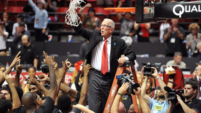 San Diego State coach Steve Fisher reacts after cutting down the net after the Aztecs won the 2015-16 regular-season MW title.