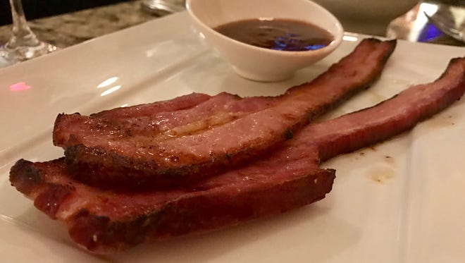 Nueske's bacon comes served in two thick slabs at Courtside Steakhouse.