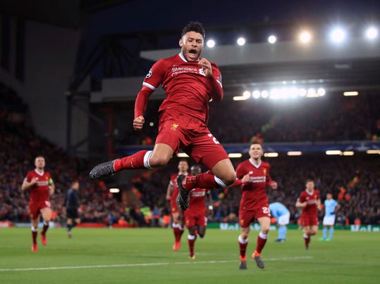 Liverpool's Alex Oxlade-Chamberlain celebrates after scoring his side's second goal of the game during the Champions League quarter final, first leg soccer match between Liverpool and Manchester City at Anfield, Liverpool, England, Wednesday, April 4, 2018. (Peter Byrne/PA via AP)
