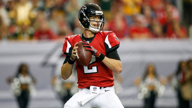Atlanta Falcons quarterback Matt Ryan (2) drops back to pass against the Green Bay Packers in the second quarter at the Georgia Dome.