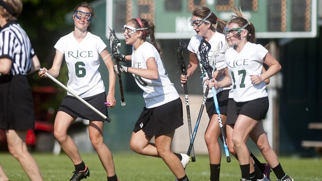 Rice players celebrate a late goal by Kristina Bellomo, center, that provided the final margin in their 13-11 playoff win over Middlebury on Saturday.