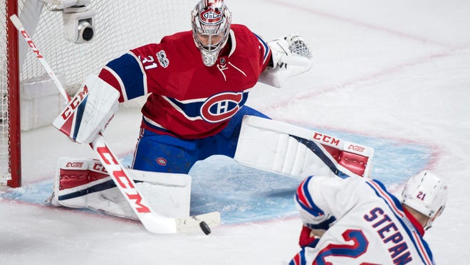Montreal Canadiens goaltender Carey Price stops a shot by New York Rangers' Derek Stepan during first-period Game 2 NHL Stanley Cup first-round playoff hockey game action Friday, April 14, 2017, in Montreal. (Paul Chaisson/The Canadian Press via AP)