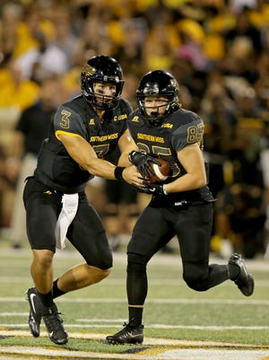 Southern Miss quarterback Parker Adamson (3) hands off to wide receiver Ben Olinger (85) in the second half of last week's game against Savannah State.
