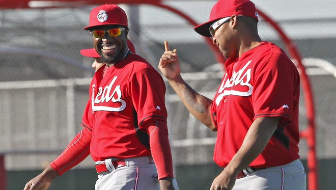 Reds second baseman Brandon Phillips, left, and outfielder Marlon Byrd share a laugh during spring training in Goodyear.