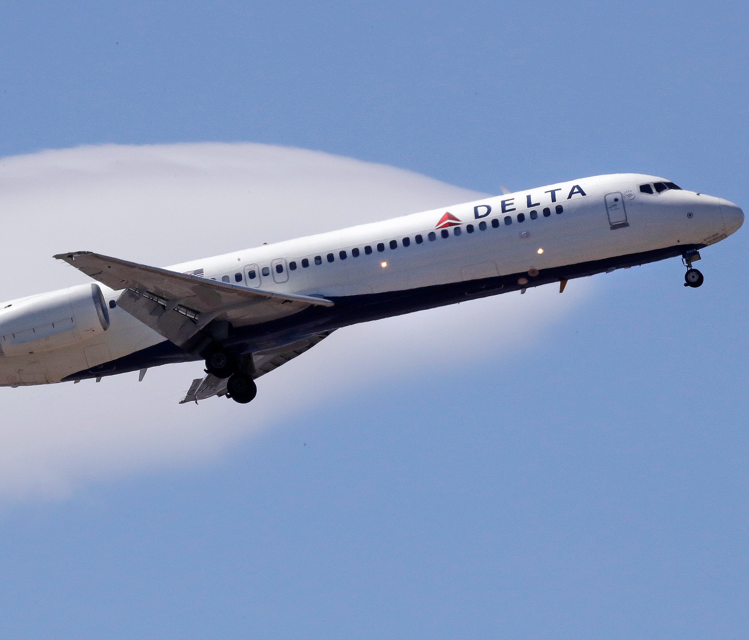 A Delta Air Lines passenger jet plane, a Boeing 717-200 model, approaches Logan Airport in Boston on May 24, 2018.