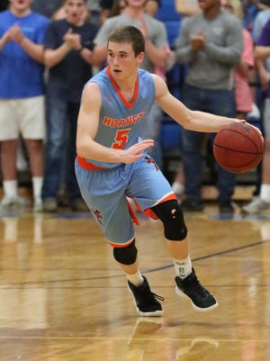 South Gibson's Nathan Hicks brings the ball up the court against McNairy Central in a Region 7-AA quarterfinal game on Saturday.