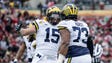 Michigan Wolverines defensive end Chase Winovich, left,
