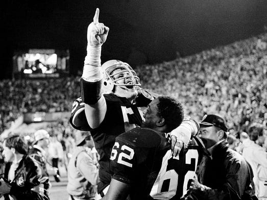 Super Bowl XVIII (Raiders 38, Redskins 9): Los Angeles Raiders linebacker Matt Millen gestures as he celebrates with nose tackle Reggie Kinlaw (62) following their win.