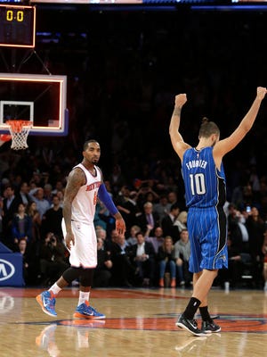 Orlando Magic's Evan Fournier, right, celebrates after Knicks' J.R. Smith missed the final shot of the game on Wednesday, in New York. The Magic won 97-95.