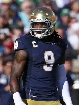 Notre Dame linebacker Jaylon Smith (9) waits at the line against Navy during the first half of an NCAA college football game, Saturday, Oct. 10, 2015, in South Bend, Ind.