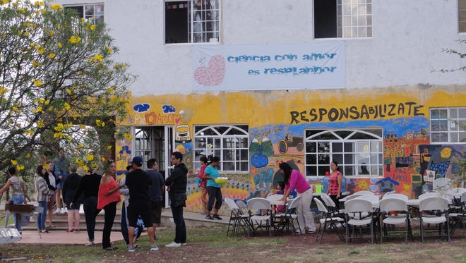 Visiting students prepare for a meal outside Resplandor International near Guanajuato, Mexico