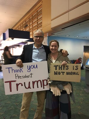 Steve Spinnett, left, went to the Portland International Airport on Sunday, Jan. 29, 2017 to thank President Trump for his executive orders banning certain immigrants and refugees. He and his wife met and befriended people strongly against the orders.