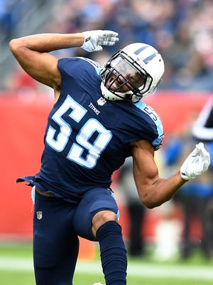 Titans linebacker Wesley Woodyard (59) celebrates his tackle in the first half against the Bengals on Sunday.