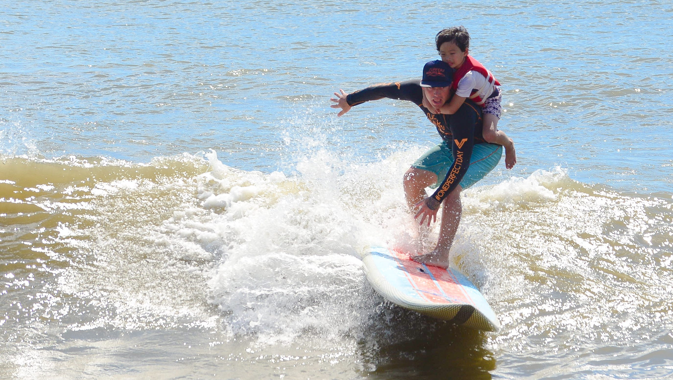 children-with-autism-find-peace-surfing-in-oc