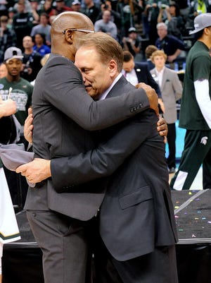 Michigan State Head coach Tom Izzo hugs assistant coach Mike Garland  after the Spartans won the Big Ten Tournament Championship game 66-62 over Purdue, Sunday, March, 13, 2016 at Bankers Life Fieldhouse in Indianapolis. 